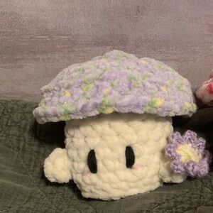Crocheted Mushroom Plush holding a flower